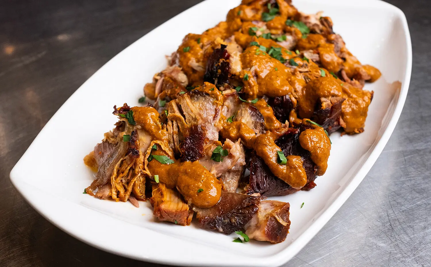 Succulent pork roast, marinated overnight in a spicy harissa, garlic, and pomegranate molasses mixture.