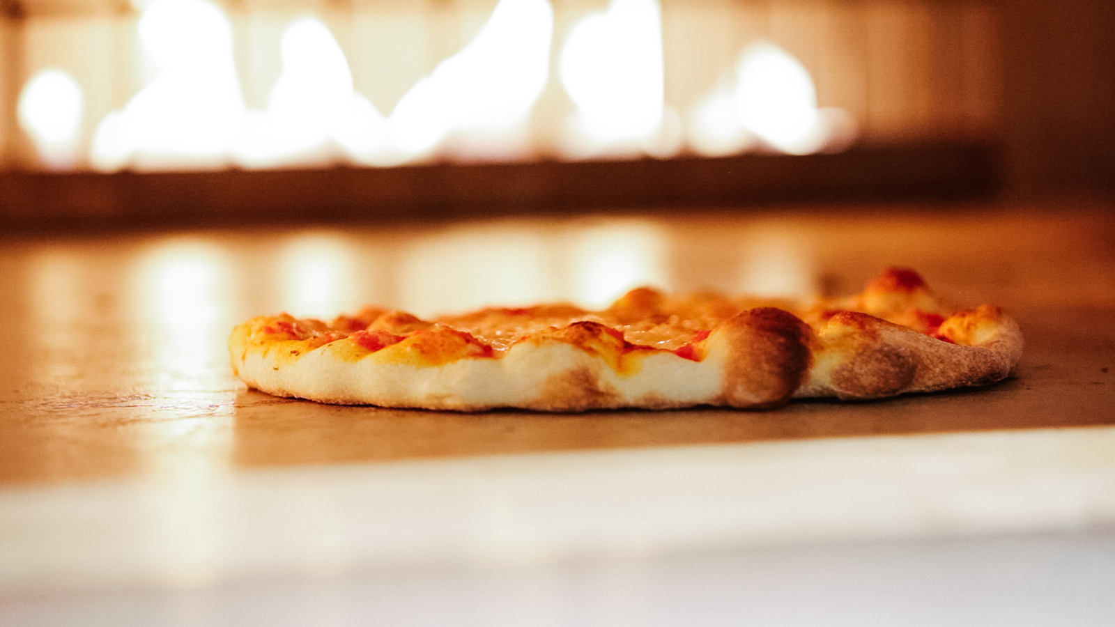 Pizza on oven hearth