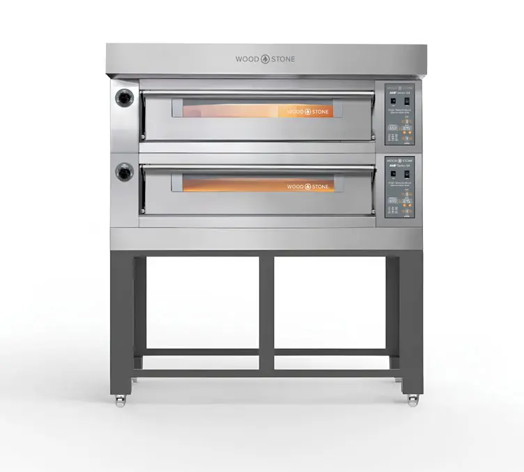 A front-facing studio view of the stainless steel Wood Stone AMP Series 64 double-deck electric oven mounted on a dark wheeled stand against a seamless white background.